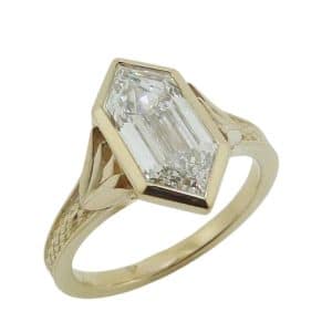 14K Yellow gold custom bezel set Art Deco style engagement ring with a 2.06 carat E, VS1 hexagonal step cut lab grown diamond.