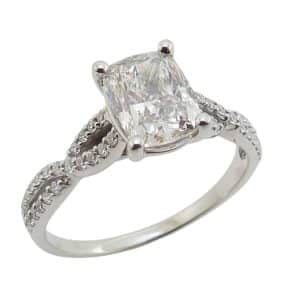 14K White gold claw set twist engagement ring set in the centre with a 1.55 carat I, VS2 elongated cushion lab grown diamond, and accented on the band with forty-four natural round brilliant cut diamonds, 0.22cttw, G/H, SI1-2.