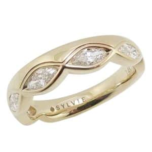 14K Yellow gold lady's diamond assymetrical band bezel set with five marquise diamonds totaling 0.57 carats.