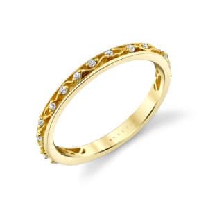 14K Yellow gold open filigree diamond band by Sylvie Jewelry claw set with fifteen round brilliant cut diamonds totaling 0.09 carats.