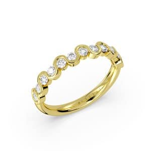 14K Yellow gold wavy diamond band by Sylvie Jewelry half bezel set with twelve round brilliant cut diamonds totaling 0.57 carats.