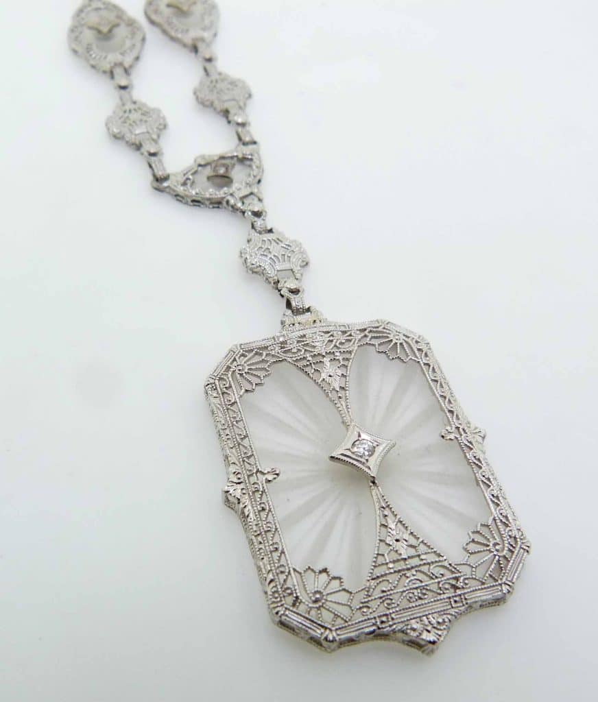 Estate item - 14K White gold 14.5" filigree detailed necklace with carved rock crystal with four round brilliant cut diamonds, 0.07cttw.