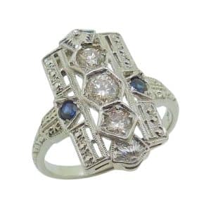 Estate item - 18K White gold lady's filigree ring with three round brilliant cut diamonds, 0.35cttw and two blue sapphires, 0.10cttw.