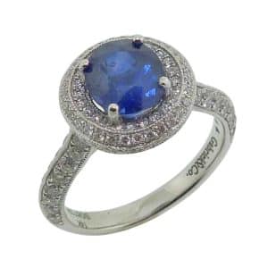 Estate item - 14K White gold lady's double halo ring claw set with a 1.84 carat oval blue sapphire and accented with 125 pave set natural round brilliant cut diamond's, 1.0cttw. 