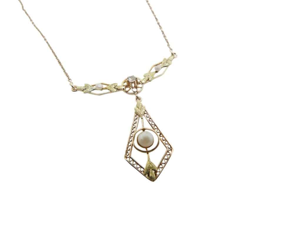 Estate item - 17" 10K Yellow and green gold necklace with seed pearls and a claw set 0.03 carat old cut diamond, H/I, SI.
