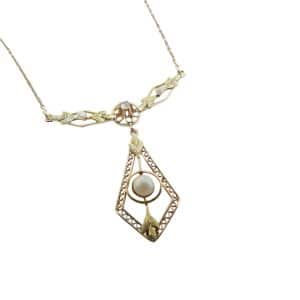 Estate item - 17" 10K Yellow and green gold necklace with seed pearls and a claw set 0.03 carat old cut diamond, H/I, SI.