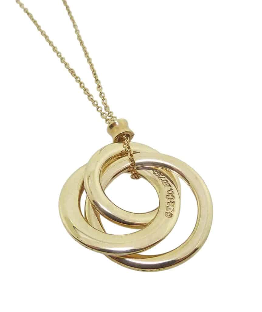 Estate item - 18" Tiffany & Co three interlocking open circles pendant on chain.