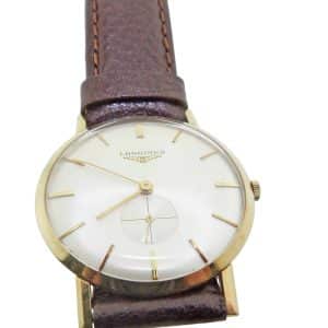 Estate item - 14K Yellow gold men's Longine's mechanical watch in mint condition with new (not original) leather strap.