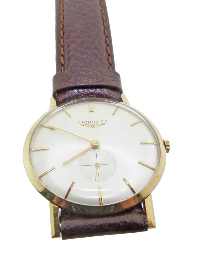 Estate item - 14K Yellow gold men's Longine's mechanical watch in mint condition with new (not original) leather strap.