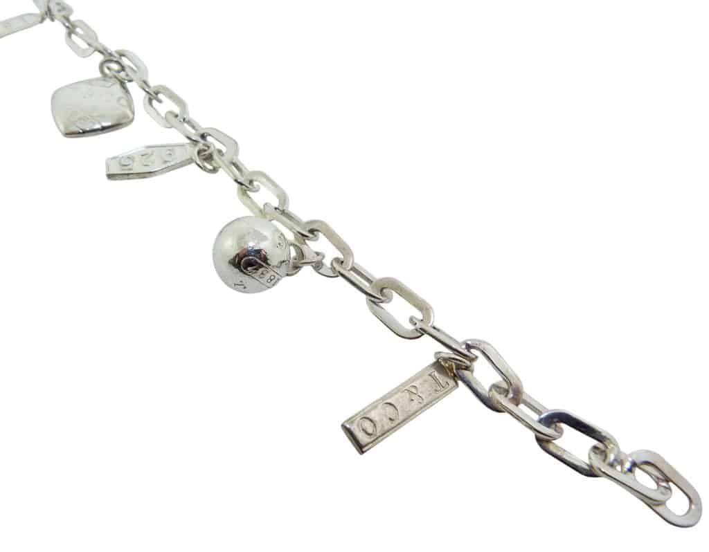 Estate item - 7.5" silver charm bracelet.