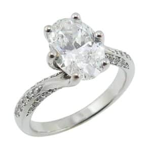 14K White gold six prong bypass style engagement ring claw set with a 2.02 carat, D, VVS2, oval brilliant cut lab grown diamond and accented with thirty-two natural round brilliant cut diamonds, 0.22cttw, G/H, VS-SI.