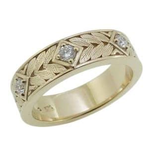 14K Yellow gold engraved texture men's band with three lab grown round brilliant cut diamonds, 0.20cttw, D/E, VS-VVS.