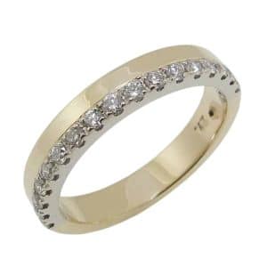 14K Yellow and white gold band claw set with seventeen round brilliant cut natural diamonds totaling 0.257 carats, G-H, SI, very good cut.