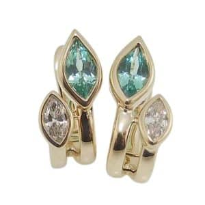 14K Yellow gold leverback earrings bezel set with two Chatham lab grown 7x3.5mm flame cut chrysoberyl, 0.72cttw, and two marquise lab grown diamonds, 0.25cttw