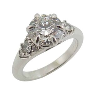 14K White gold Queen Elizabeth inspired engagement ring claw set with a 1.55 carat, D, VVS2 round brilliant cut lab grown diamond and eight round brilliant cut lab grown diamonds, 0.261cttw, D-F, VVS-VS.