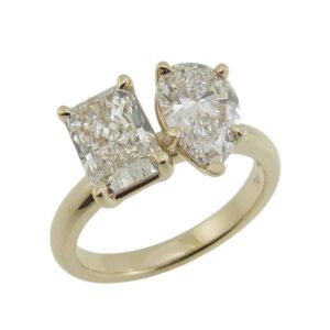 14K Yellow gold Toi et Moi engagement ring claw set with a 1.59 carat D, VVS2 radiant cut lab grown diamond and a 1.55 carat D, VVS2 pear brilliant cut lab grown diamond.