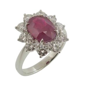 18K White gold lady's cluster style halo ring claw set with a 2.19 carat oval ruby with AIGS gem cert and ten natural round brilliant cut diamonds, 1.18cttw.