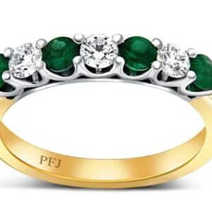 18K White and yellow gold lady's band claw set with four emeralds, 0.45cttw, and three round brilliant cut diamonds, 0.35cttw.