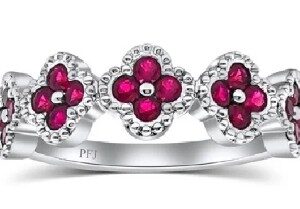 14K White gold lady's clover style band set with 0.60cttw rubies.