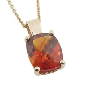14K Yellow gold pendant claw set with a 2.81 carat checkerboard citrine and eighteen very good cut, round brilliant cut natural diamonds, 0.077cttw, G/H, SI.
