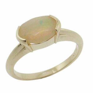 14K Yellow gold lady's ring semi-bezel set with a oval faceted 1.15 carat ethiopian opal.