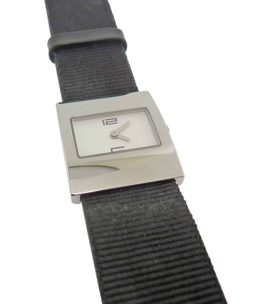 Estate Lady's Gucci watch with rectangular stainless steel case and black fabric strap.