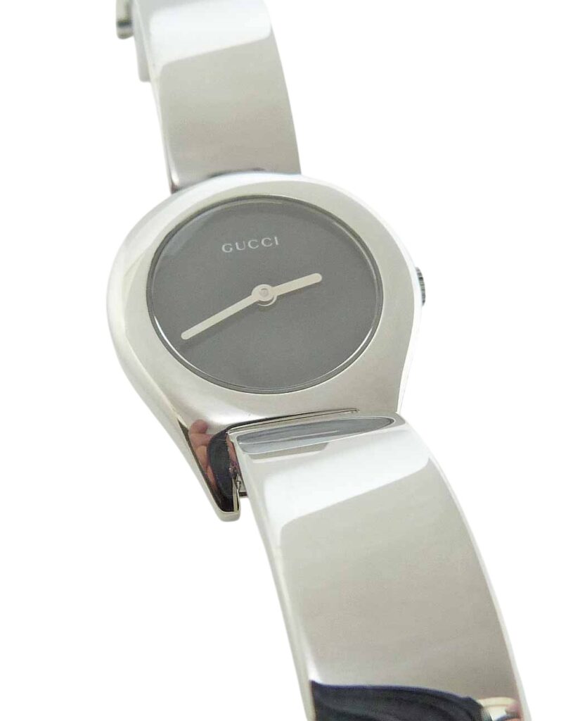 Estate Lady's Gucci stainless steel watch with black face.